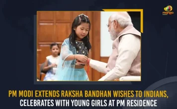 PM Modi Extends Raksha Bandhan Wishes To Indians Celebrates With Young Girls At PM Residence, PM Modi Celebrates Raksha Bandhan with Youngsters at his Residence in New Delhi, Prime Minister Narendra Modi Celebrates Raksha Bandhan with Youngsters at his Residence in New Delhi, Narendra Modi celebrates Raksha Bandhan with daughters of PMO staff, Raksha Bandhan with Youngsters, Prime Minister Narendra Modi, PM Modi, Raksha Bandhan, Raksha Bandhan Wishes, Raksha Bandhan Greetings, 2022 Raksha Bandhan, PM Modi News, PM Modi Latest News, PM Modi Latest Updates, PM Modi Live Updates, Mango News,